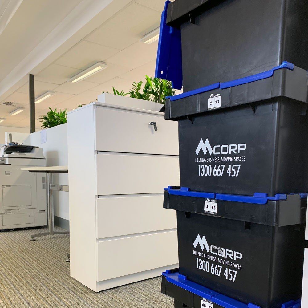 Mcorp crates next to filing cabinet