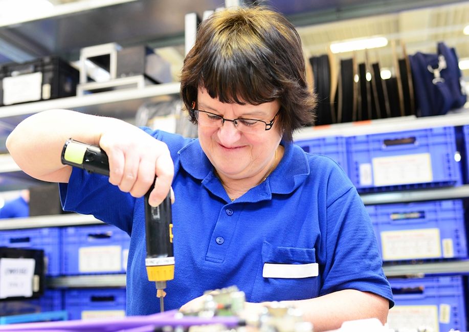 Woman assembling electrical parts copy